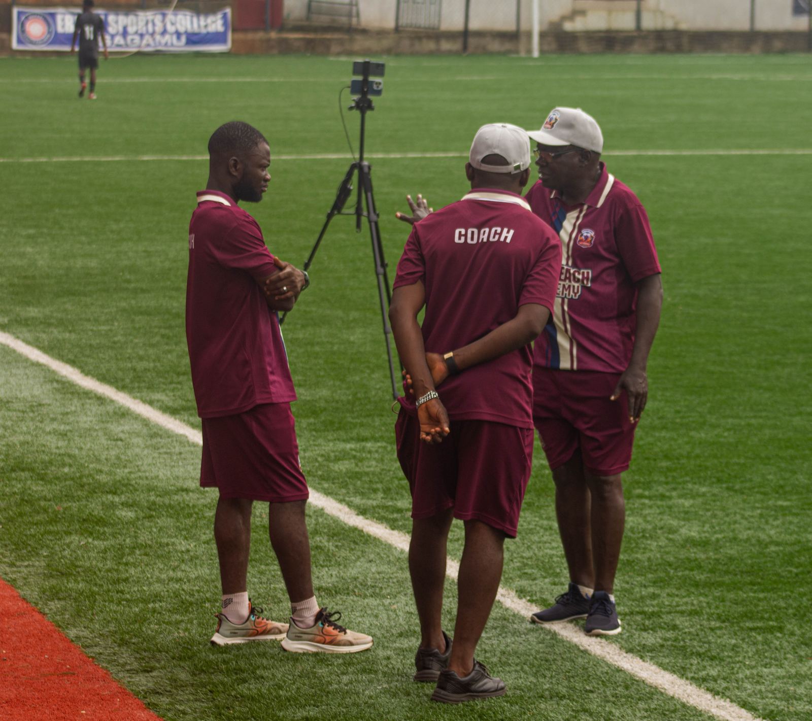 KEDOPEACH Academy coaches talking on the training pitch