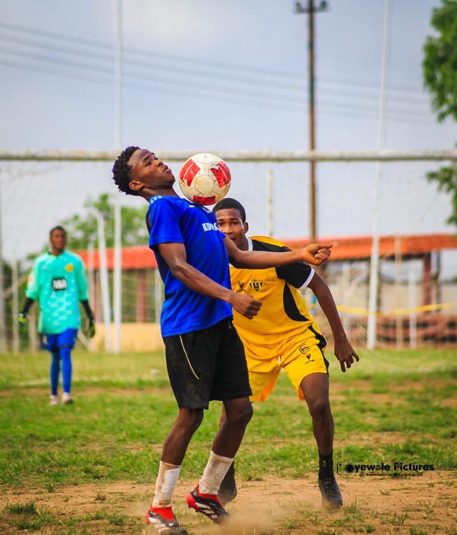 KEDOPEACH player contesting a header near goal